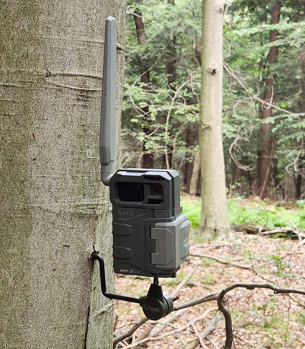 This is a spypoint trail camera in a forest and is used to capture wildlife photography